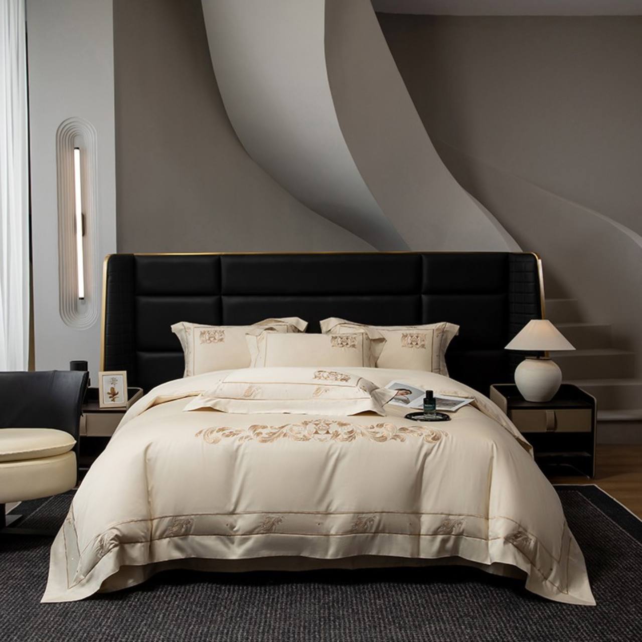 Premium cream embroidered bedding with decorative stitching and layered pillows