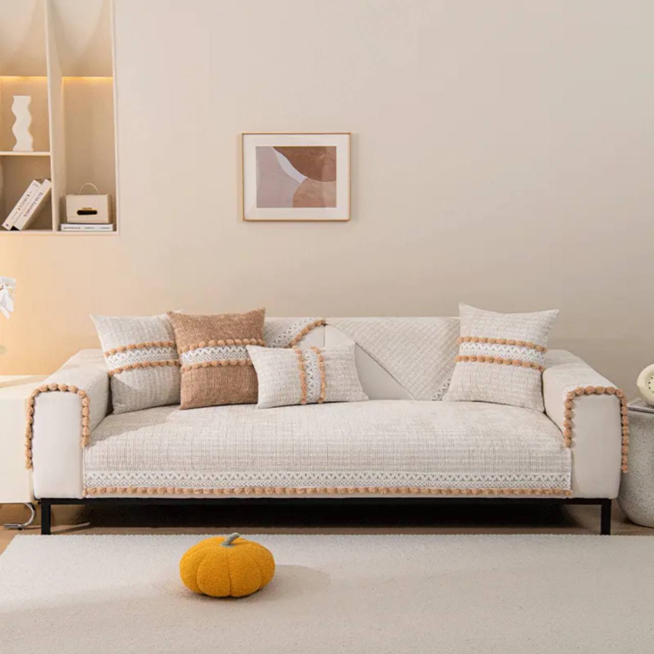 Beige sofa cover, cushions and coordinated upholstery textiles for soft furnishing projects